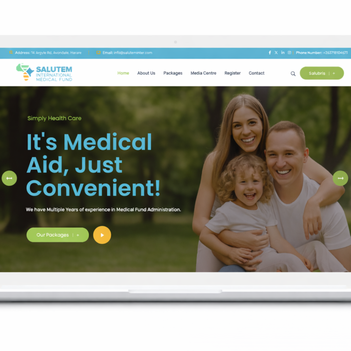 A white laptp with the Salutem Website Landing page opened. The salutem logo is visible and there are 3 white individuals, parents and a boy child