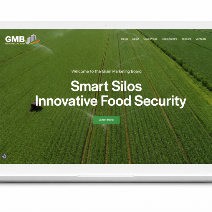 A white laptop with the GMB website landing page opened