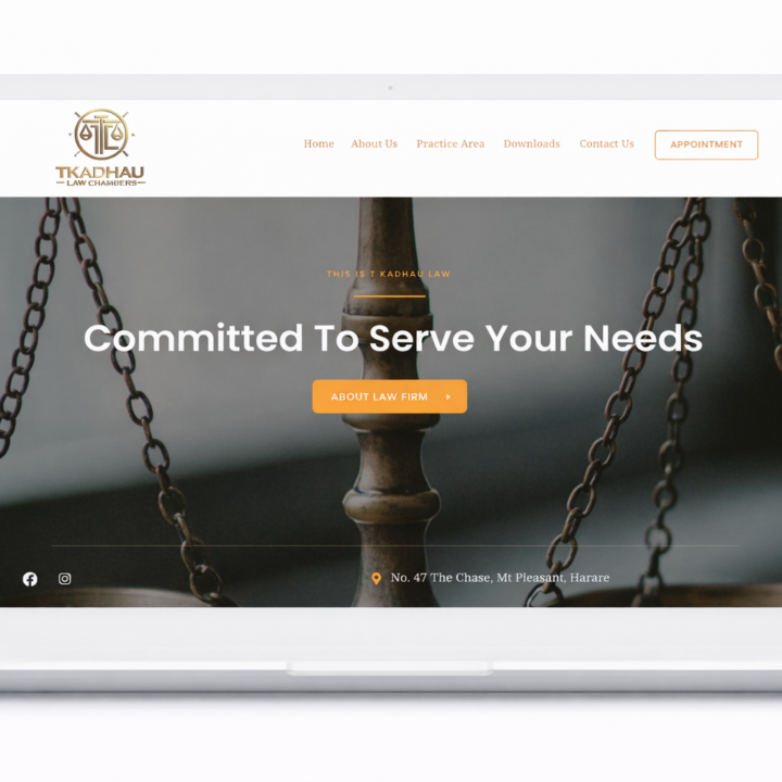 A white laptop with the T Kadhau website opened